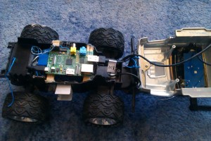 This shows the inside of the car, the board in the center is a Raspberry Pi, the one in the cabin of the car the wifi. 